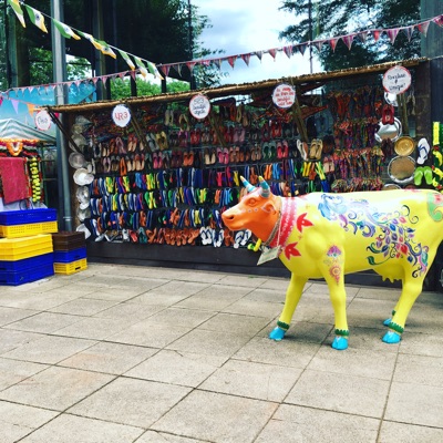 A typical street scene in India highlighting the sacred cow and comfortable footwear — all part of the London Zoo’s magnificent exhibit on Asiatic lions.